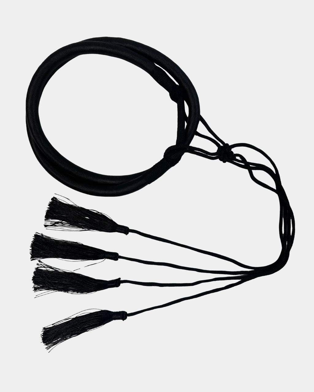 "Agal noir déroulé montrant les pompons de fixation