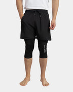 Short de sport caché awra noir porté avec legging intégré jusqu'au genou
